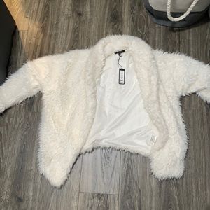 Cream colored 100% polyester.